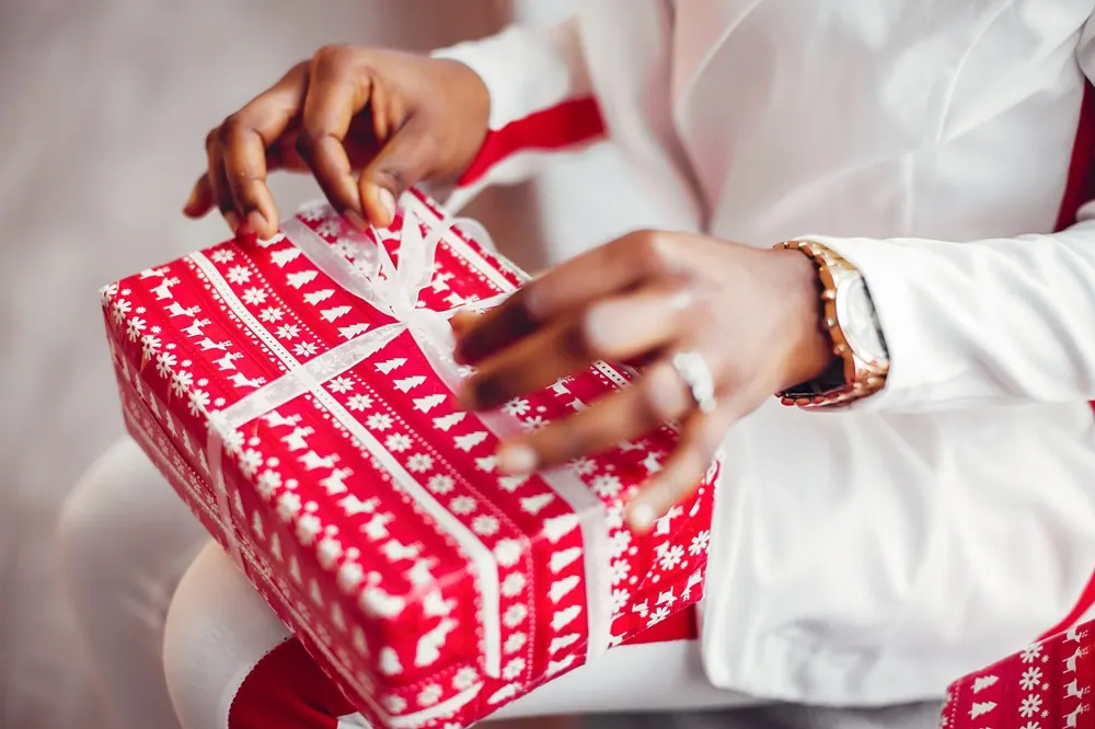 A recipient enjoying a carefully chosen Christmas gift